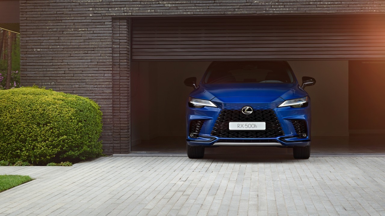 A Lexus RX 500h parked in a garage opening